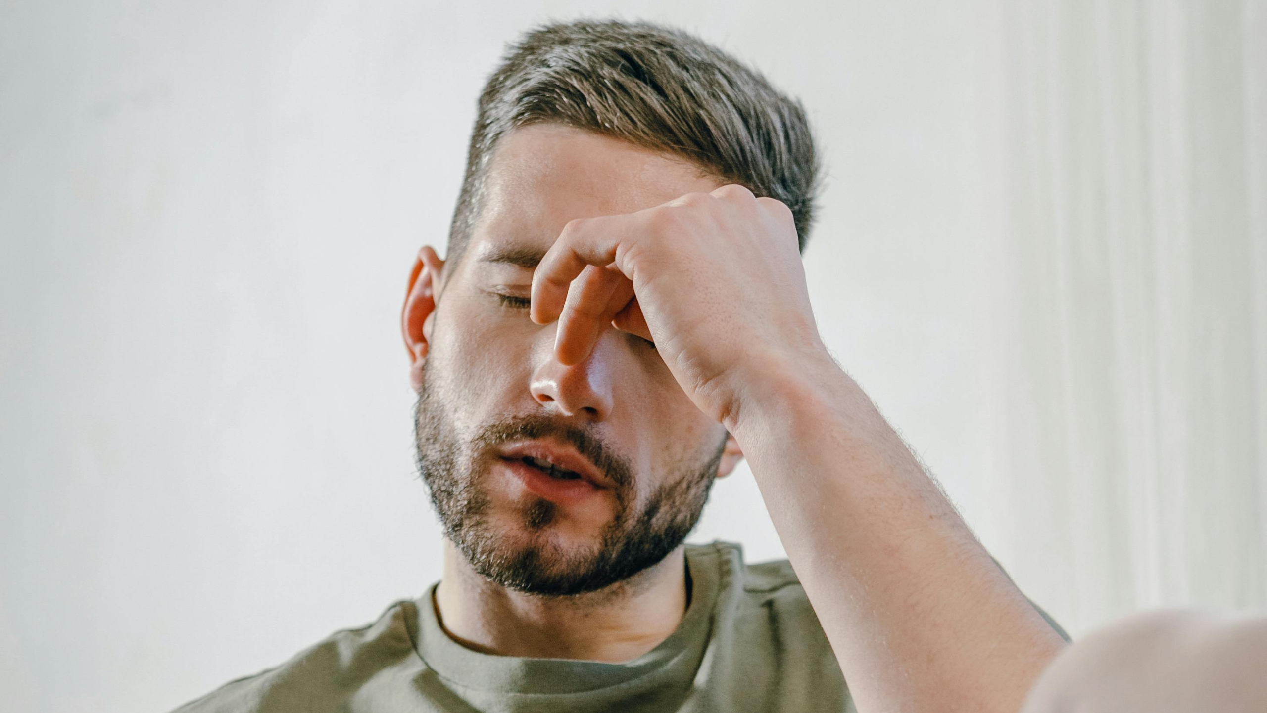man with headache looking for chiropractor queen creek az