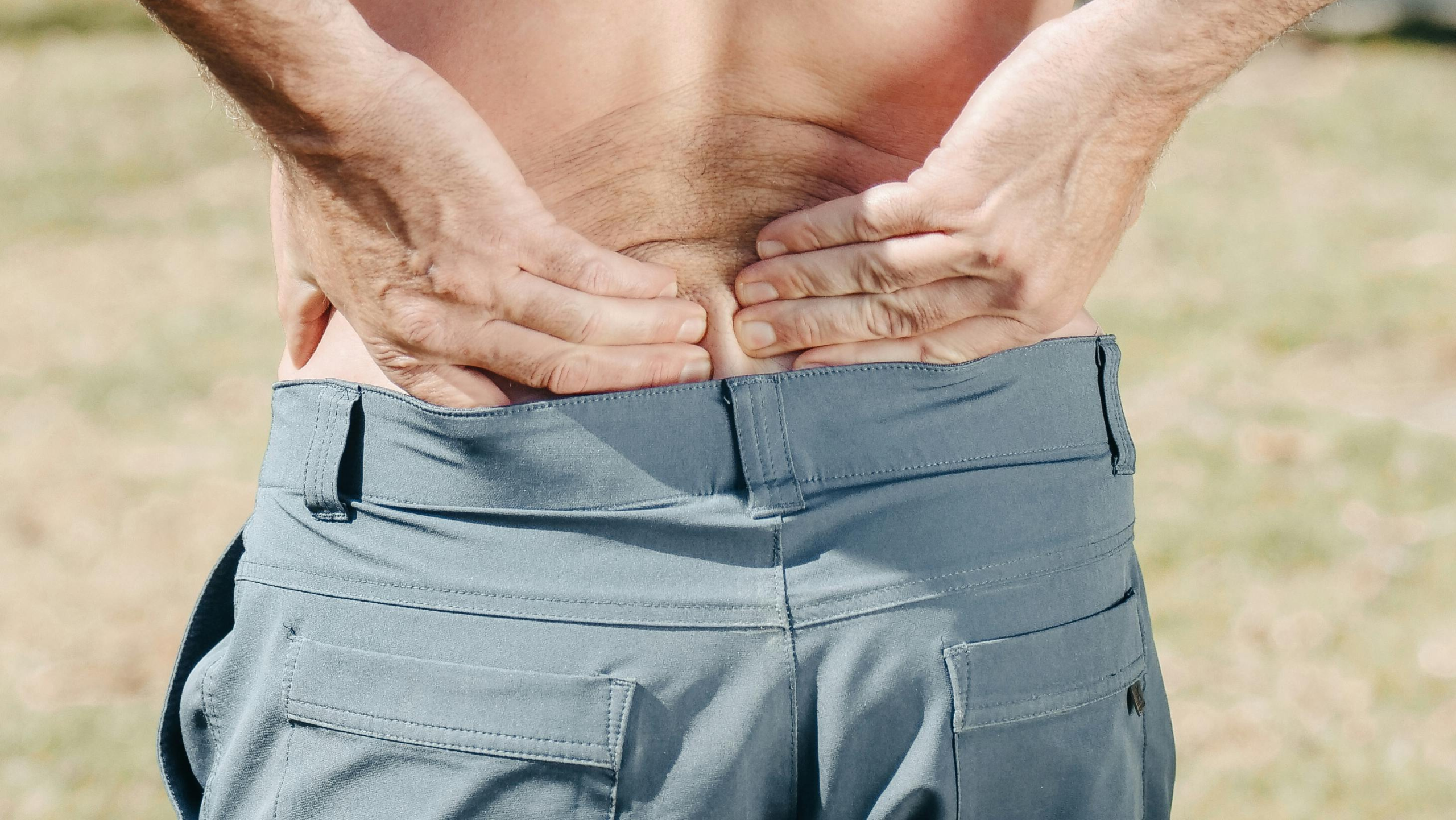 man with low pain seeking relief from a chiropractor in queen creek