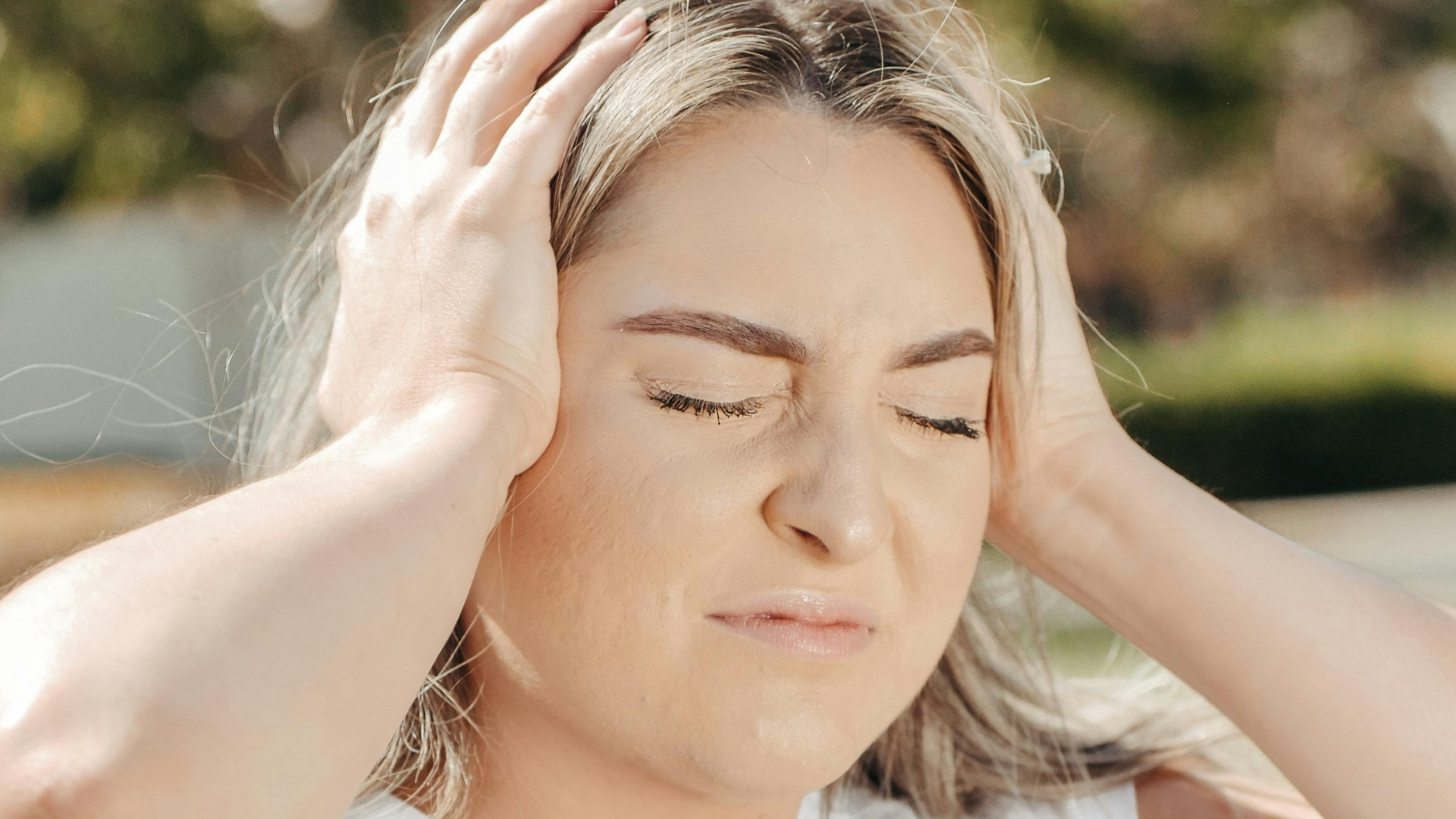 woman with headache seeking chiropractic care in San Tan Valley, AZ